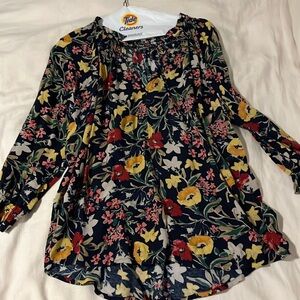 Tie neck peasant top. Navy blue with floral design.